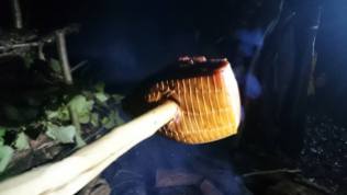 Spit roasting wildhoney glazed gammon ham on oak smoked fire